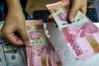 Kasus Harian Covid-19 di Bawah 10.000,  Rupiah menguat