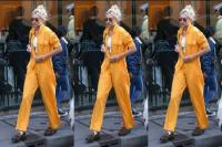 Gigi Hadid Kenakan Jumpsuit Oranye Usai Melenggang di Runway Paris Fashion Week