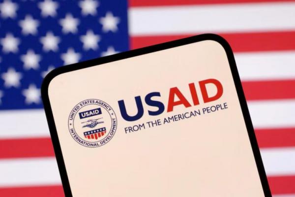 Logo USAID dan bendera AS terlihat dalam ilustrasi yang diambil pada tanggal 23 April 2025. REUTERS 