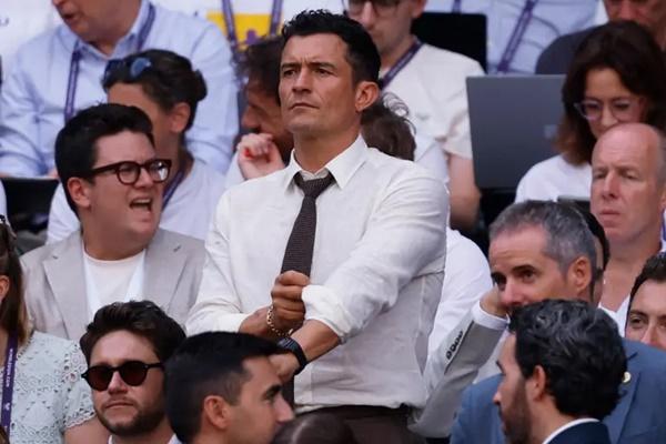 Orlando Bloom menghadiri hari terakhir turnamen tenis Wimbledon di London, Minggu (13/7/2025). (FOTO: REUTERS) 
