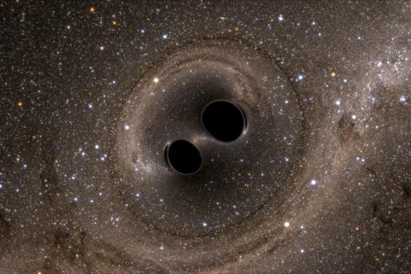 Tabrakan lubang hitam yang pertama kali terdeteksi oleh LIGO ditunjukkan di sini dalam simulasi komputer yang dirilis pada 11 Februari 2016. (FOTO: The SXS) 